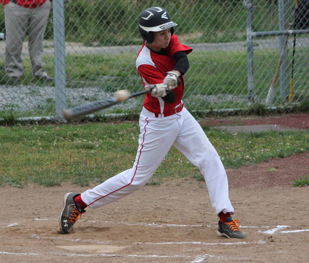 Cody Roberts makes contact with a pitch. (Photo by Jim Waller/Whidbey News-Times)