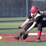 Jada Heaton scoops up a grounder at third base. (Photo by John Fisken)