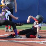 Central Whidbey&rsquo;s Taylor Brotemarkle slides under the tag of Reese Wasinger. (Photo by Jim Waller/Whidbey News-Times)