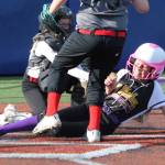 Central Whidbey catcher Teagen Calkins tags out Caidence Meadors on a close play at the plate. (Photo by Jim Waller/Whidbey News-Times)