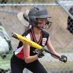 Stella Johnson looks to bunt against Orcas Island. (Photo by John Fisken)