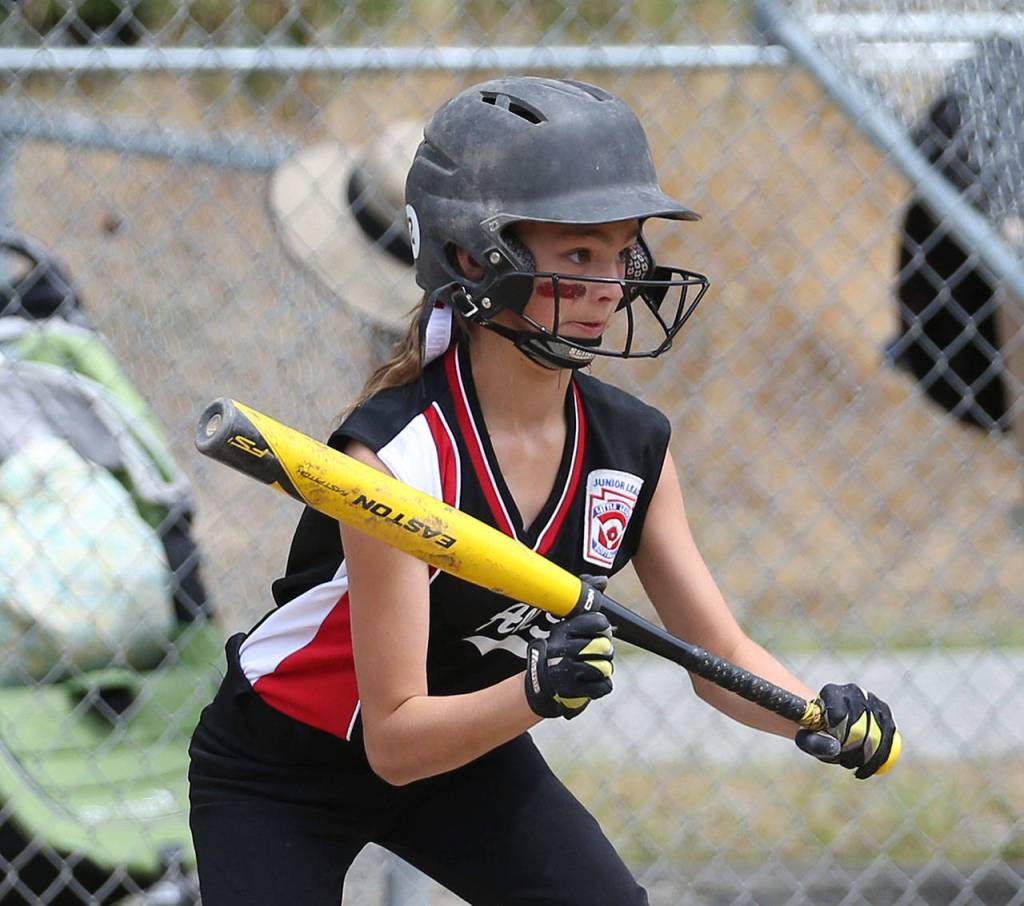Stella Johnson looks to bunt against Orcas Island. (Photo by John Fisken)