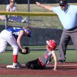Central Whidbey&rsquo;s Mia Farris slides in safely at third base in the district opening game Tuesday. (Photo by John Fisken)