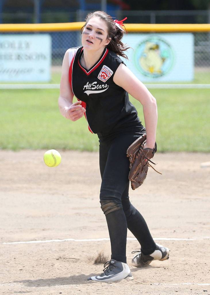 Central Whidbey pitcher Melody Wilkie burns in a strike Saturday. Wilkie finished with 14 strikeouts in the first game. (Photo by John Fisken)
