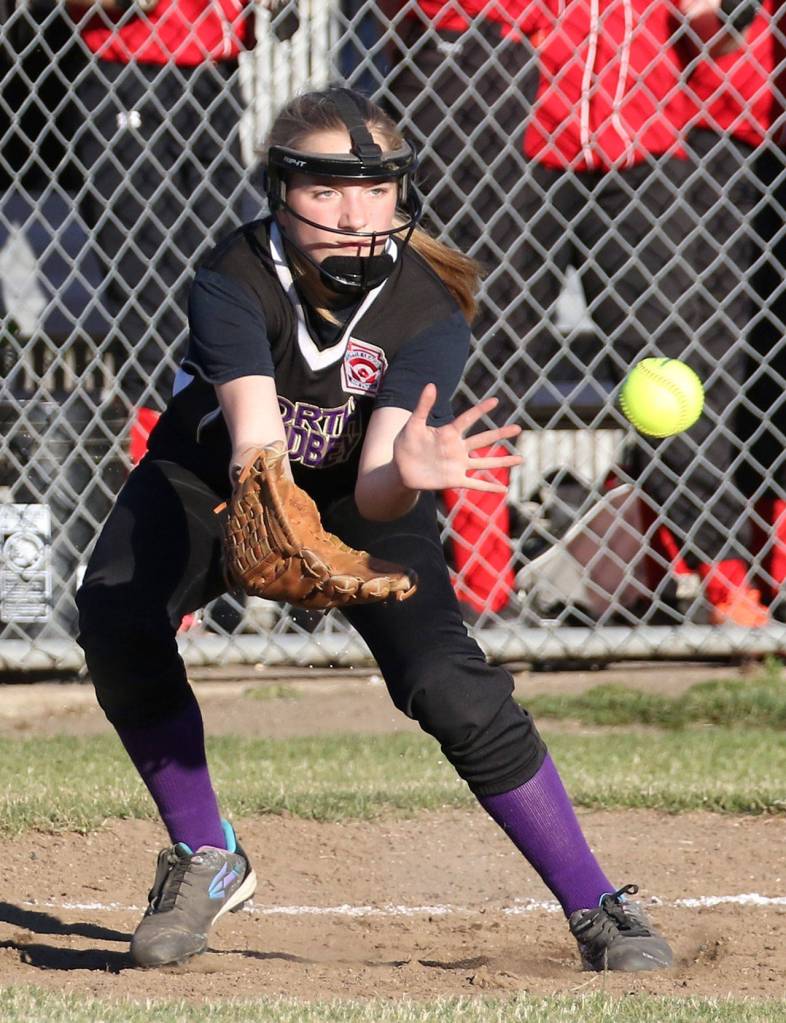 North Whidbey first baseman Kali Bobsin looks in a throw in Friday&rsquo;s win. (Photo by John Fisken)