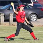 Outfielder Vivian Farris tosses the ball to the infield for Central Whidbey Friday. (Photo by John Fisken)
