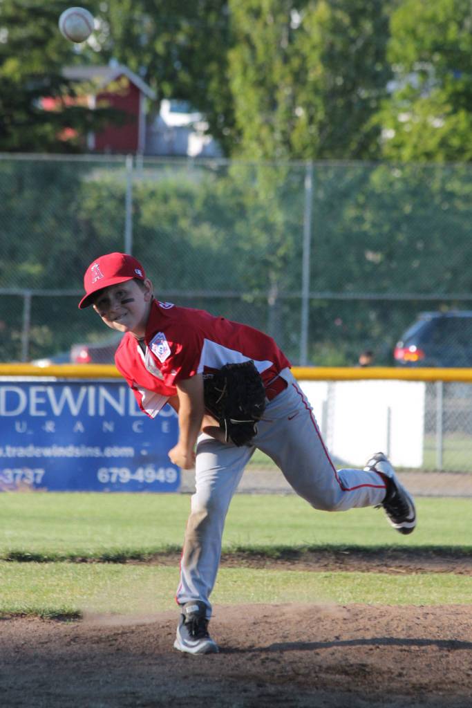 Christian Gisvold hurls a pitch for the Angels. (Photo by Jim Waller/Whidbey News-Times)