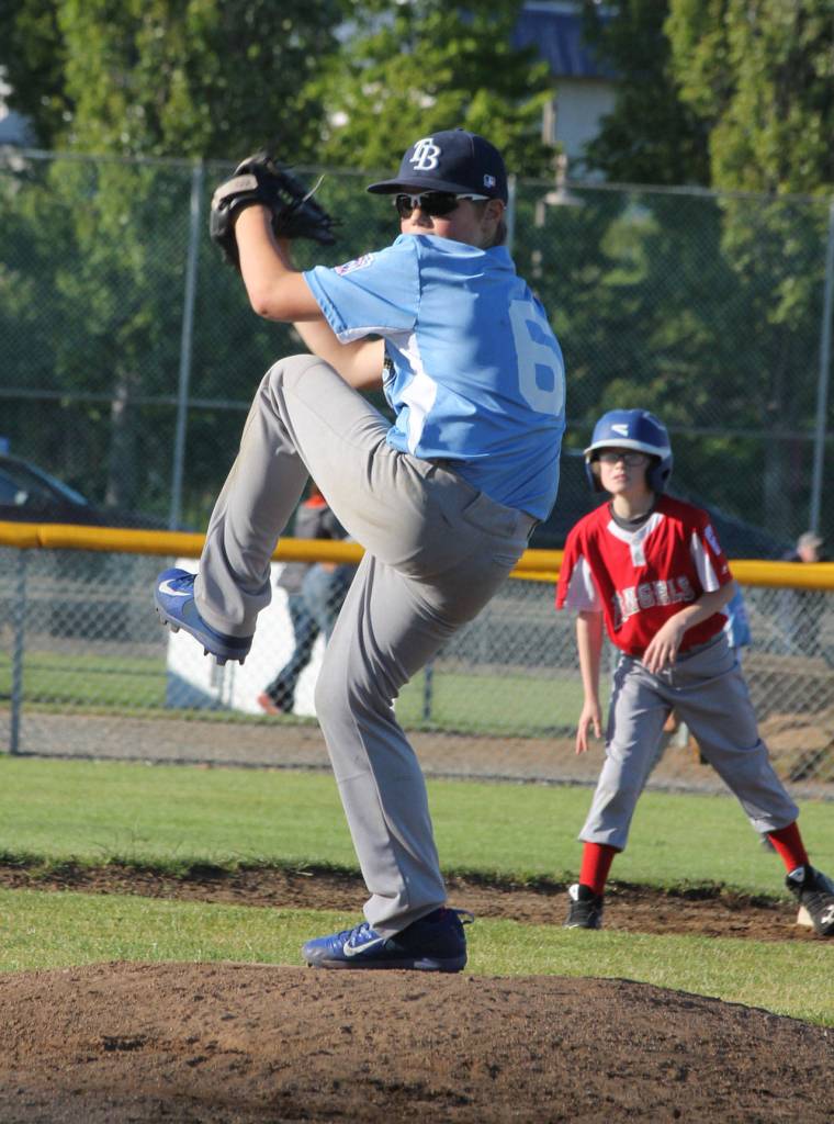 The Rays&rsquo; Travis Westman goes into his windup in Friday&rsquo;s game with the Angels. (Photo by Jim Waller/Whidbey News-Times)