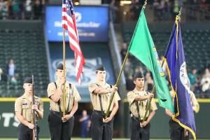 Oak Harbor NJROTC color guard presents flag at Mariners’ game
