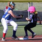 Keli Atanguri-Plummer scoots into third base ahead of the tag. (Photo by John Fisken)