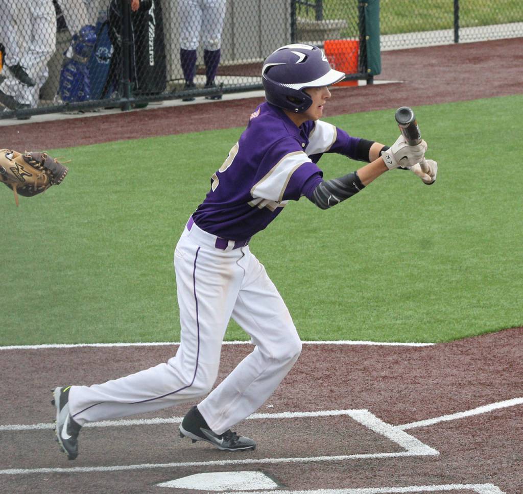 Joe Dixon attempts to bunt for Oak Harbor. (Photo by Jim Waller/Whidbey News-Times)