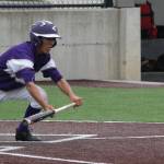 Caleb Fitzgerald puts down a squeeze bunt to score the Wildcats&rsquo; winning run Saturday. (Photo by Jim Waller/Whidbey News-Times)