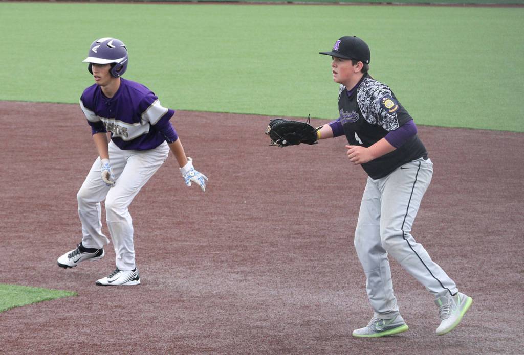 Taylor Rummel leads off first base in the Anacortes game Saturday. (Photo by Jim Waller/Whidbey News-Times)