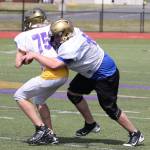 Wildcats, Wolves hit field for spring camp / Football