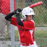 Chelsea Prescott focuses on the next pitch in a recent Babe Ruth game. (Photo by Jim Waller/Whidbey News-Times)