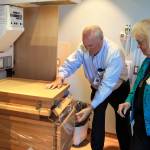 Building facilities administrator, George Senerth, who oversaw more than 18 months of hospital construction, demonstrates elements of the four labor and delivery rooms to commissioner Nancyjean Fey.                                Photo by Patricia Guthrie/Whidbey News-Times