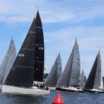 J-class boats line up for the start of race Monday. Many sails are not traditional white these days because they are made of lighter material, such as carbon fiber and Kevlar.