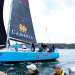 A chase boat takes in the start of competition at the Monday opening of Race Week. The annual event attracts sailors from the Northwest and Canada who compete daily in Penn Cove.