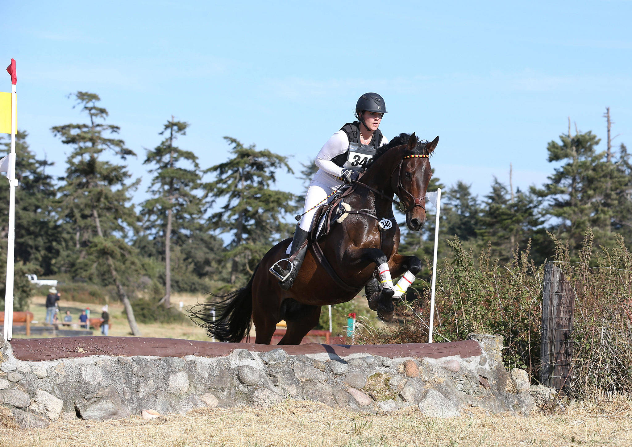 Greta Seyfried, riding I&rsquo;m Your Huckleberry, participates in cross country jumping Saturday. Seyfried attended Oak Harbor High School this past year as an exchange student. (Photo by John Fisken)