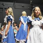 Three actresses play Alice in Whidbey Playhouse&rsquo;s current musical. Small Alice (right) is Ashley Coker, the actress playing the main role of Alice is Ella Langrock (center) and Tall Alice is played by Ashley Berry.                                Photo by Patricia Guthrie/Whidbey News-Times