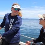 Longtime Race Week volunteers Christine Russell (left) and Liza Tewell head back to Oak Harbor Marina after observing Monday&rsquo;s first round of races.