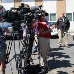 Washington State Trooper Heather Axtman speaks with TV reporters about an officer-involved shooting in Oak Harbor. Oak Harbor Police Chief Kevin Dresker is in the background. Photo by Daniel Warn/Whidbey News-Times