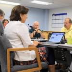 How to close 80 open cases of building and other code violations is discussed by county commissioners and planning, health and human services, law enforcement and legal staff at a recent work session of Island County Board of Commissioners.