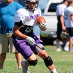 Mac Carr looks for some running room.