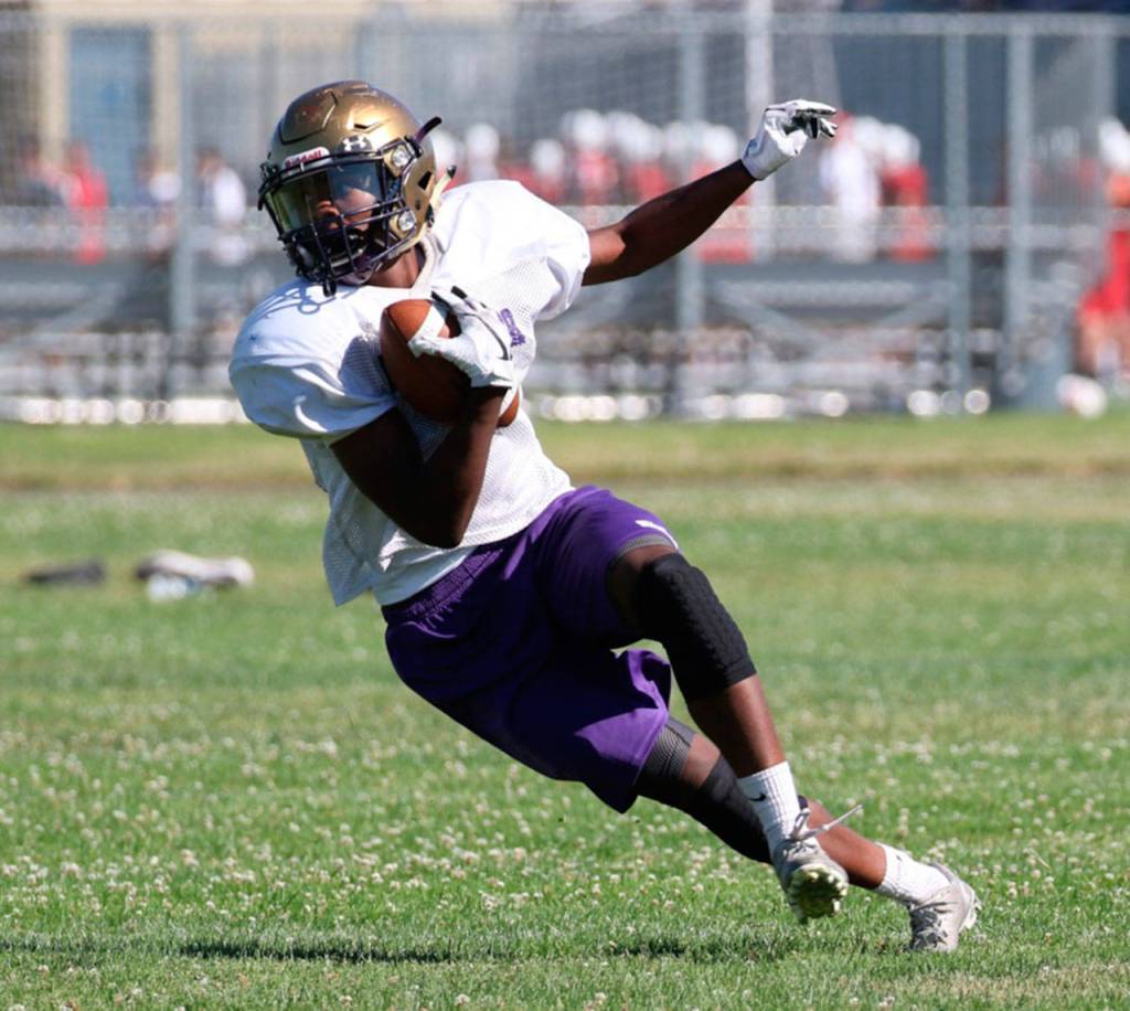 TJ Passmore cuts up field in search of running room.