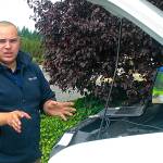 Camryn Engle, autogas coordinator for Blue Star Gas, explains Thursday how added components vehicles converted to propane can by accessed and analyzed locally or remotely by technicians. Whidbey-SeaTac Shuttle & Charter is in the process of converting its entire fleet to propane. Photo by Daniel Warn/Whidbey News-Times