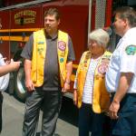 From left, Fire Chief Mike Brown, North Whidbey Lions President Jack Peebles, past-president Bonnie LaForest and Deputy Fire Chief Mark Kirko discuss their new partnership Wednesday at the VFW. North Whidbey Lions gave North Whidbey Fire and Rescue $10,000 to kick off its legacy project. Photo by Daniel Warn/Whidbey News-Times