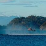 A SAR helicopter from Whidbey Island Naval Air Station rescues a distressed kayaker in Dugualla Bay Monday night. Photo by Richard Haines