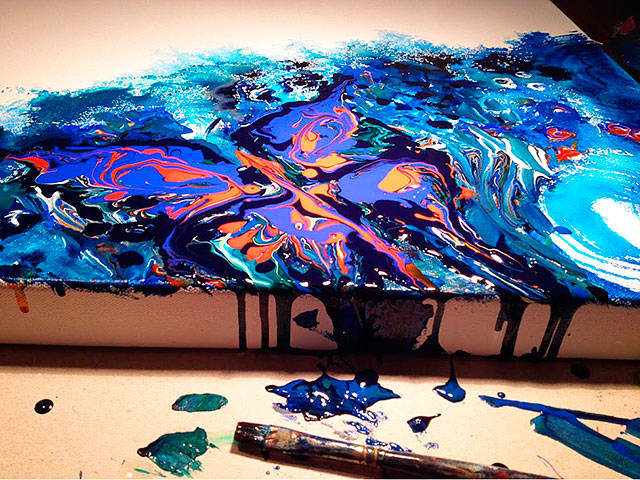 A butterfly appears to melt off the canvas as Tina Christiansen applies layers of acyrlic paint. Photo provided.