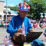The top hat and tie of band leader Bruce Seltveit leaves no doubt as to what day and which parade the All-Island Community Band performs for from the sidelines. It plays at many local festivities.
