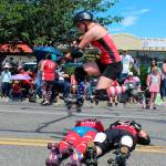 Whidbey Island Rollergirls thrilled by showing off their skills. Player &ldquo;Wild Sockeye&rdquo; jumps over two teammates, &ldquo;Lady Zombrie&rdquo; and &ldquo;T-Wrekz Yo Face.&rdquo;
