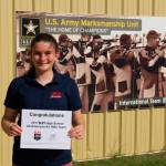 Elena Flake displays her All-American certificate. (Submitted photo)