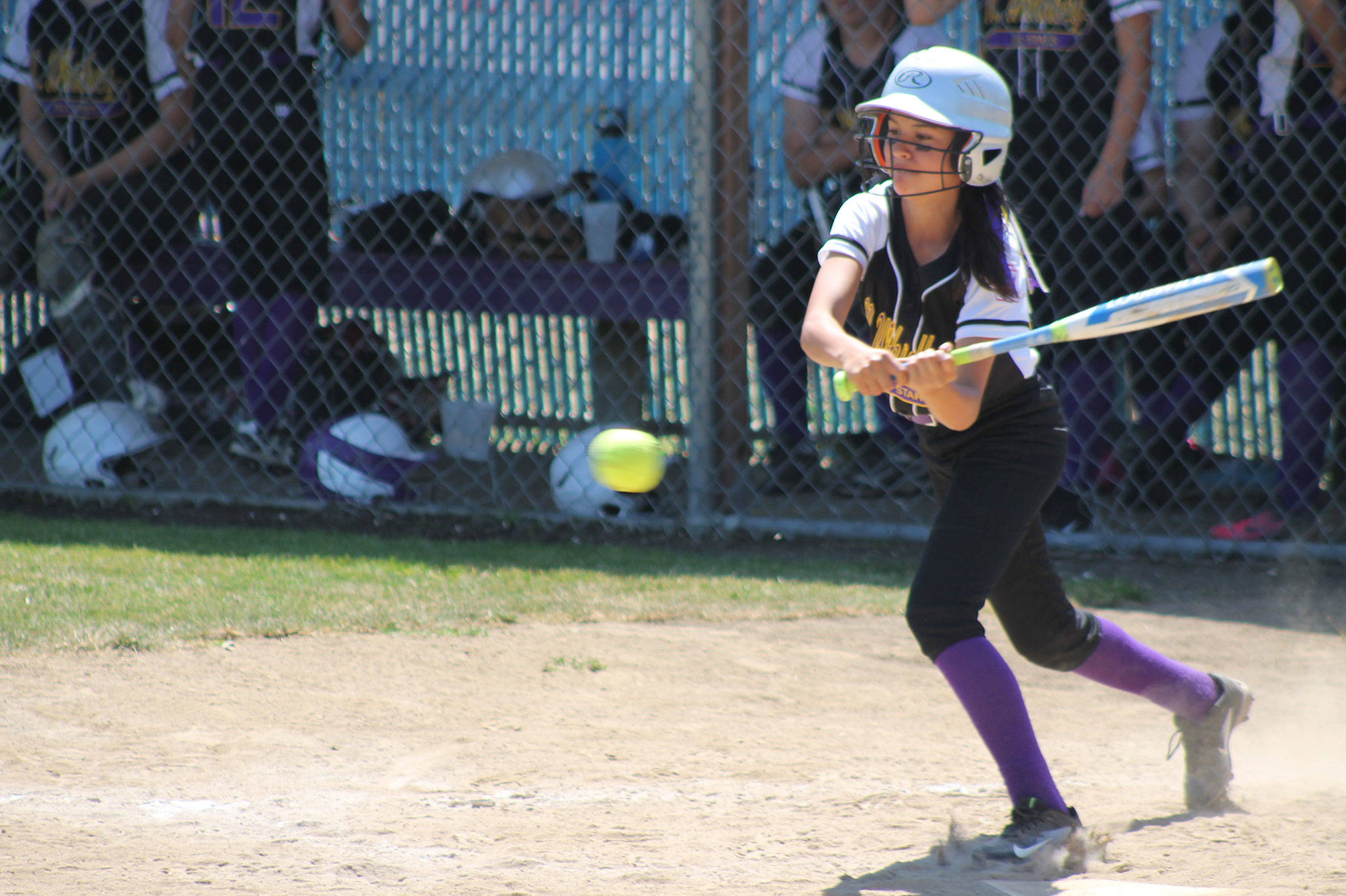 Desiree Becherer slaps at a pitch in Saturday&rsquo;s game. (Photo by Jim Waller/Whidbey News-Times)