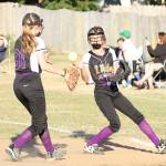 Kali Bobsin, left, tosses to Jadyn Erickson for an out. (Photo by John Fisken)