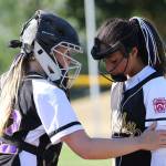 North Whidbey catcher Kayla Carr, left, consoles pitcher Macy Oliver after a rough start Thursday. (Photo by John Fisken)