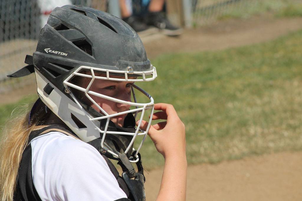 Catcher Kayla Carr looks to the dugout for the pitch call. (Photo by Jim Waller/Whidbey News-Times)