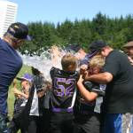 North Whidbey celebrates the district title as assistant coach Ken Harrison gives them a victory shower. (Submitted photo)