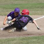 Christian Gisvold slides safely into third base as the ball slips away from the Anacortes fielder. (Photo by Jim Waller/Whidbey News-Times)