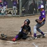 Nate Moore sneaks into home for a North Whidbey run. (Photo by Jim Waller/Whidbey News-Times)