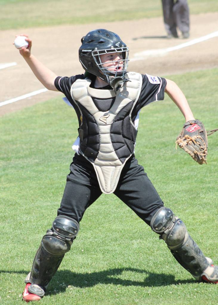 Nate Moore throws to first after fielding a swinging bunt. (Photo by Jim Waller/Whidbey News-Times)