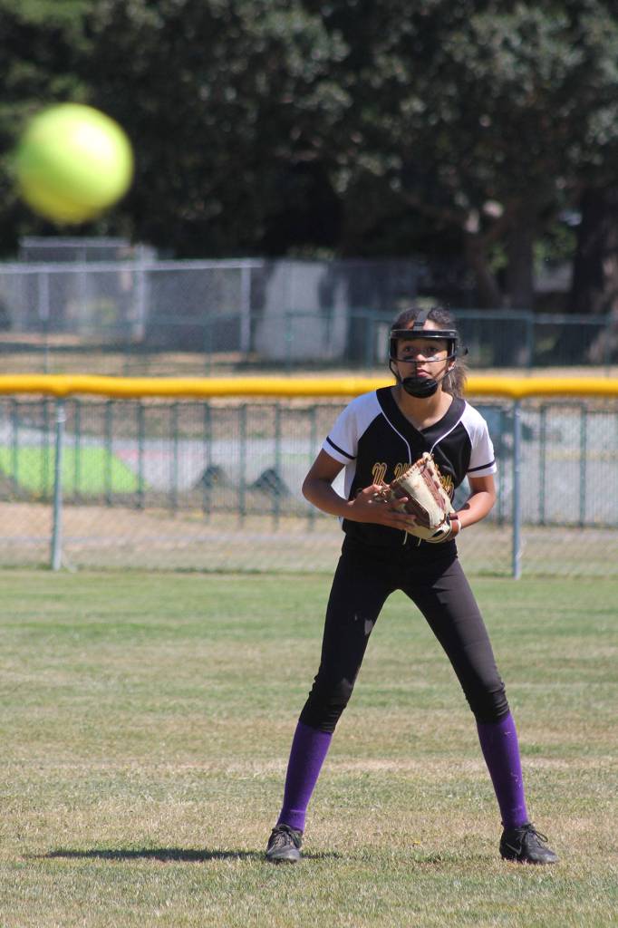 Shortstop Macy Oliver gets ready as the pitch approaches the plate. (Photo by Jim Waller/Whidbey News-Times)