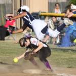 Mill Creek&rsquo;s Simone Williams, top, collides with Emily Wilson at first base in Thursday&rsquo;s game. Williams was out on the play. (Photo by John Fisken)