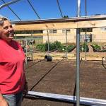 Anza Muenchow, SNAP Ed coordinator for the Washington State University Island County Extension, said she was ecstatic that the &ldquo;Navy guys&rdquo; came out to help build the Crescent Harbor&rsquo;s hoop house Wednesday. Photo by Daniel Warn/Whidbey News-Times