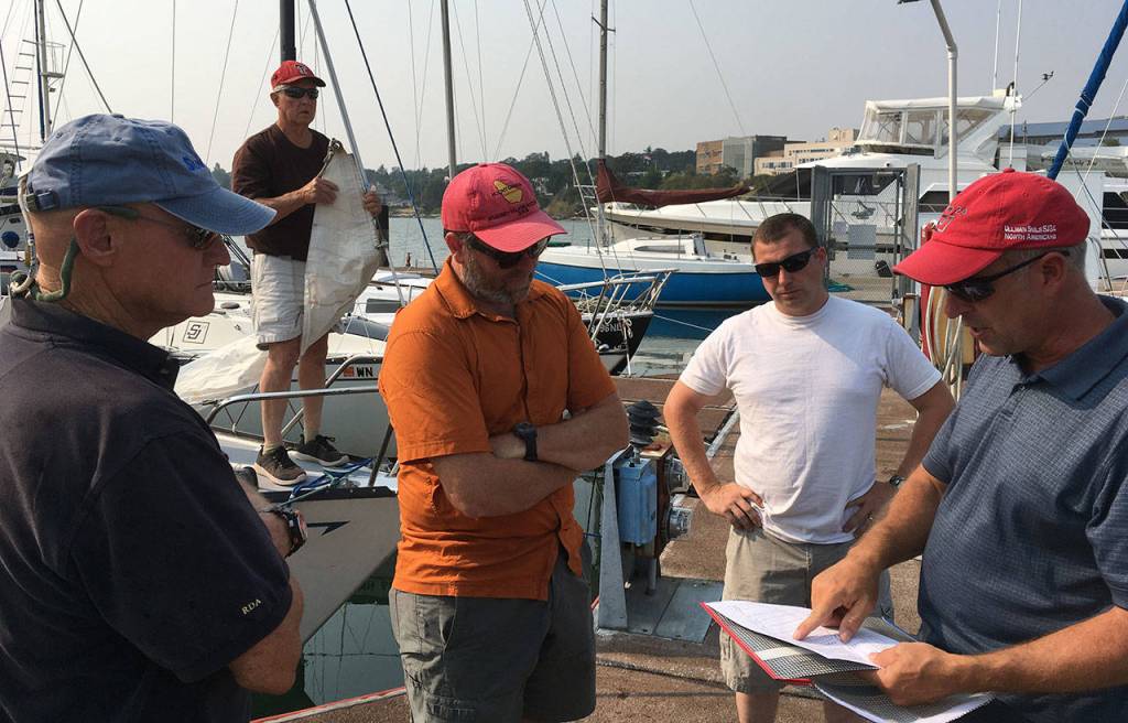 Rick Almberg, left, Allen Wilson, Bill Weinsheimer, Jason Polly and Dave Steckman discus the race course. (Photo by Bill Walker)