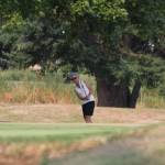 Pat West chips up to the green. (Photo by Jim Waller/Whidbey News-Times)