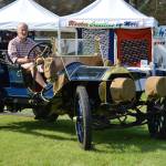 A classic car owner drives his vehicle at the North Whidbey Car Show on Saturday at Wind Jammer Park. Photo by Laura Guido/Whidbey News-Times